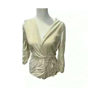 Cream colored blouse with gold sprinkle accents